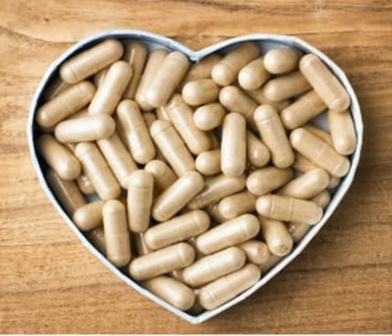 Photo of pills in heart shaped box